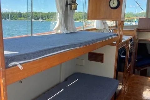 Slide: The Image of 1978 Grand Banks Trawler interior with wooden bunk beds and nautical decor. - 8