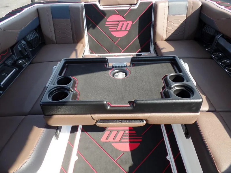 Slide: The Image of 2024 Malibu 23 LSV interior with seating and cup holders, featuring stylish design elements. - 11