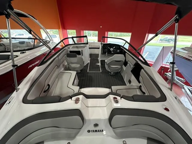 Slide: The Image of 2024 Yamaha Boats SX190 interior, spacious seating, modern design, and sleek dashboard. - 5