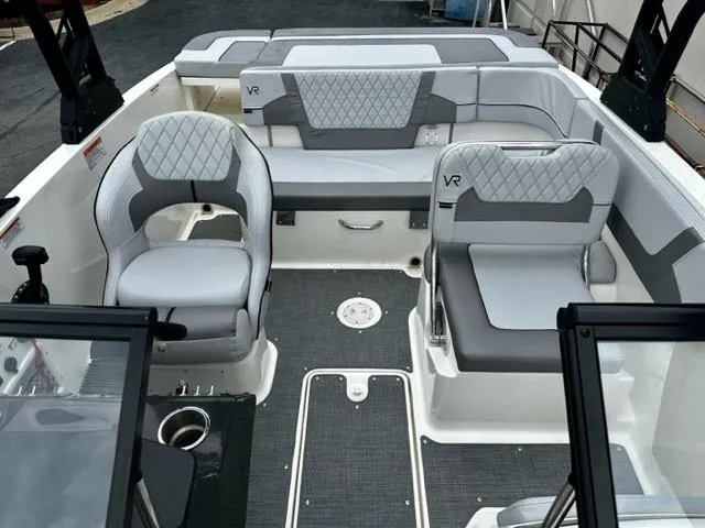 Slide: The Image of 2022 Bayliner VR5 boat interior with grey and white seating. - 10