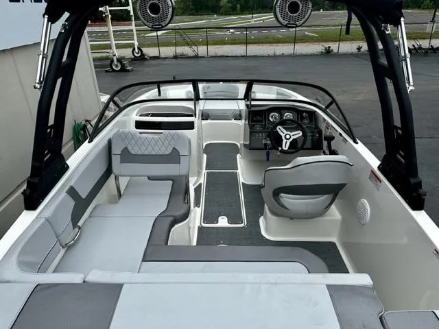Slide: The Image of 2022 Bayliner VR5 boat interior with seating and steering wheel. - 5