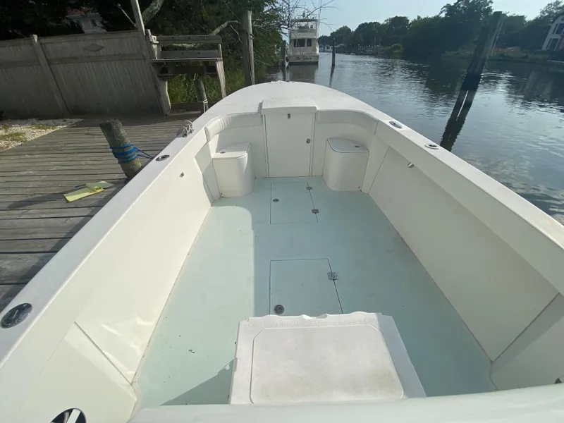 Slide: The Image of 2006 Kryptonite 41 CC boat interior docked by a calm river. - 11