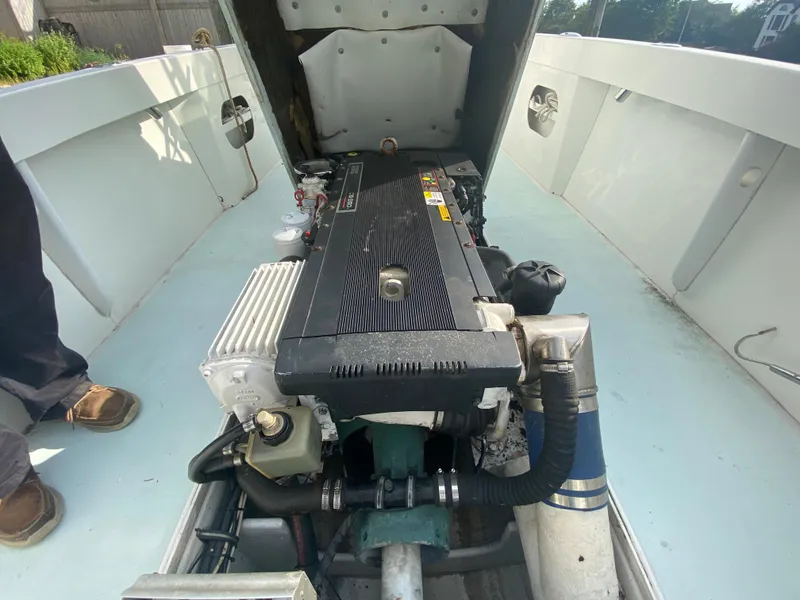 Slide: The Image of 2006 Kryptonite 41 CC boat engine compartment with visible engine components. - 14