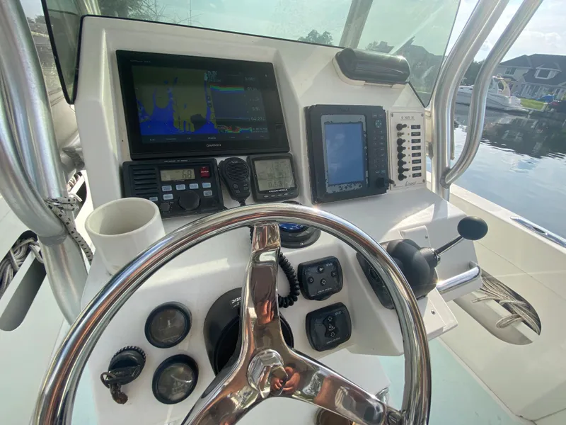 Slide: The Image of 2006 Kryptonite 41 CC boat dashboard with navigation and control systems. - 17