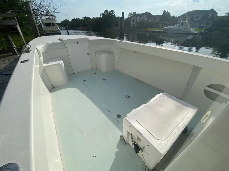 Slide: The Image of 2006 Kryptonite 41 CC boat interior with seating and storage compartments. - 9