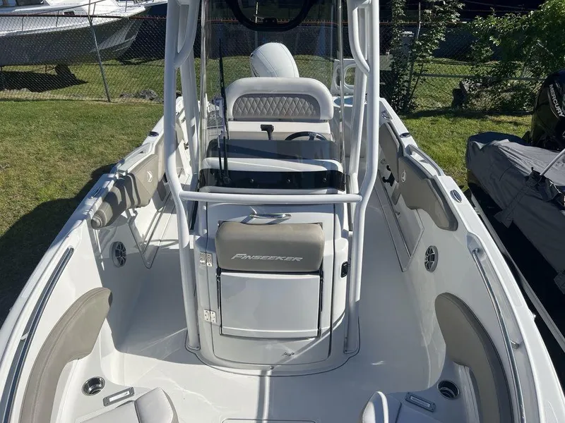 Slide: The Image of 2024 Finseeker 210 FS boat interior with seating and console. - 11