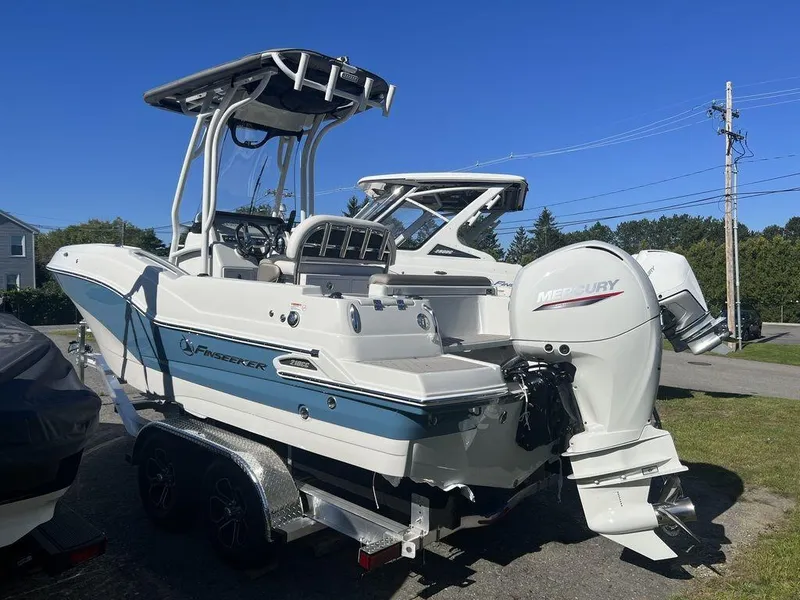 Slide: The Image of 2024 Finseeker 210 FS boat with Mercury outboard engine on trailer. - 4