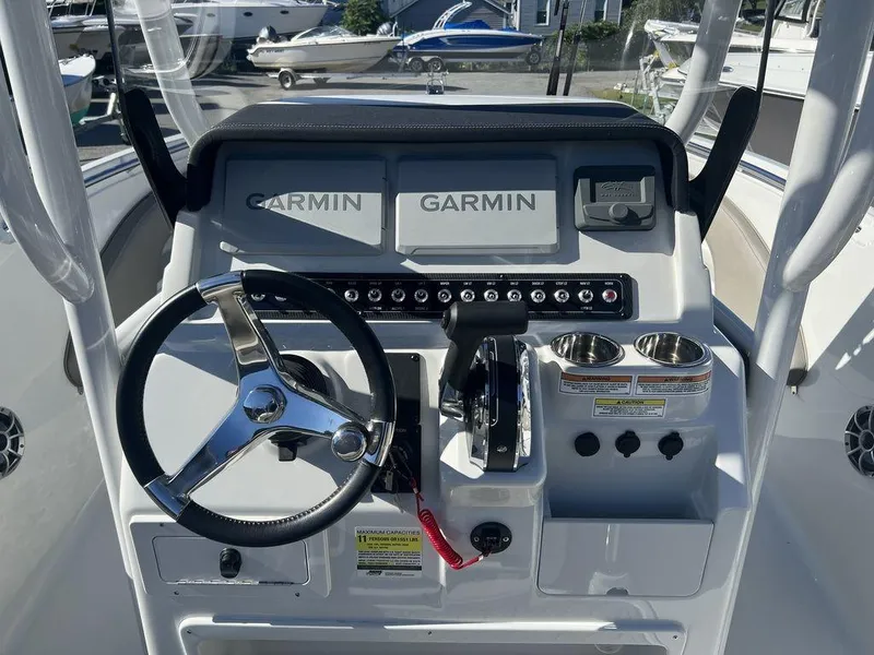 Slide: The Image of 2024 Finseeker 210 FS boat dashboard with Garmin navigation system. - 6
