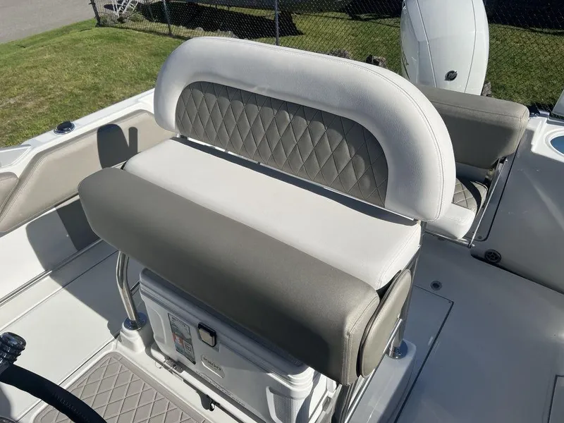 Slide: The Image of 2024 Finseeker 210 FS boat seating with cushioned backrest and storage compartment. - 7