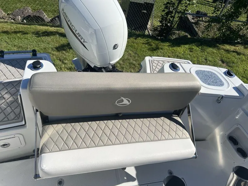 Slide: The Image of 2024 Finseeker 210 FS boat with Mercury engine and cushioned seating. - 8