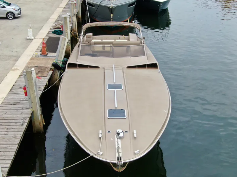 Slide: The Image of 1998 Magnum 50 Bestia boat docked at marina, aerial view. - 10