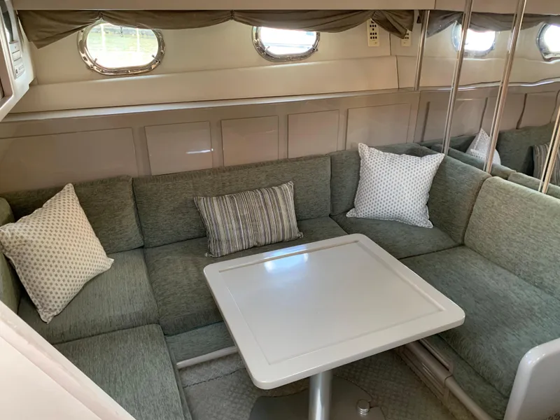 Slide: The Image of Interior of 1998 Magnum 50 Bestia yacht with cozy seating and table. - 18