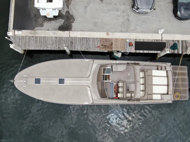 Slide: The Image of Overhead view of 1998 Magnum 50 Bestia yacht docked at a pier. - 2