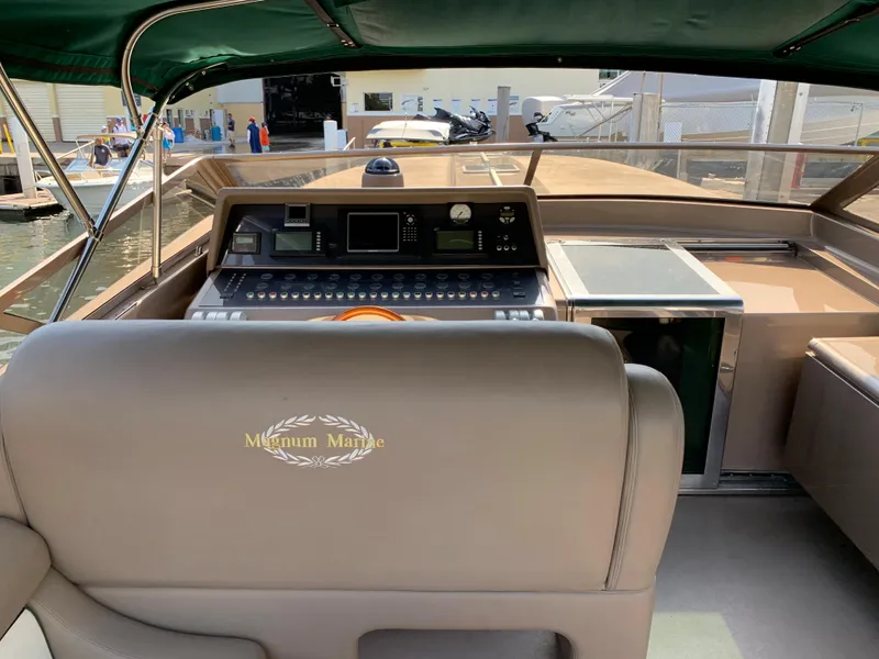 Slide: The Image of Cockpit of 1998 Magnum 50 Bestia yacht with control panel and seating. - 20