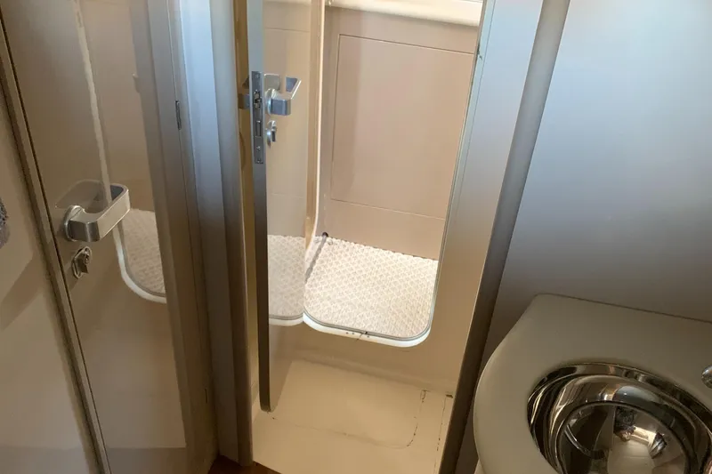 Slide: The Image of Bathroom interior of 1998 Magnum 50 Bestia yacht with shower and sink. - 23