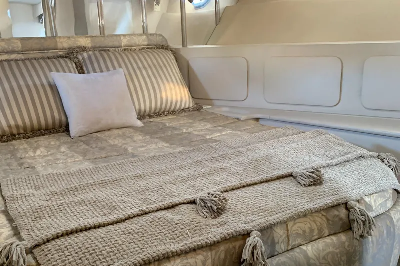 Slide: The Image of Luxurious bedroom interior of 1998 Magnum 50 Bestia yacht with elegant bedding. - 24