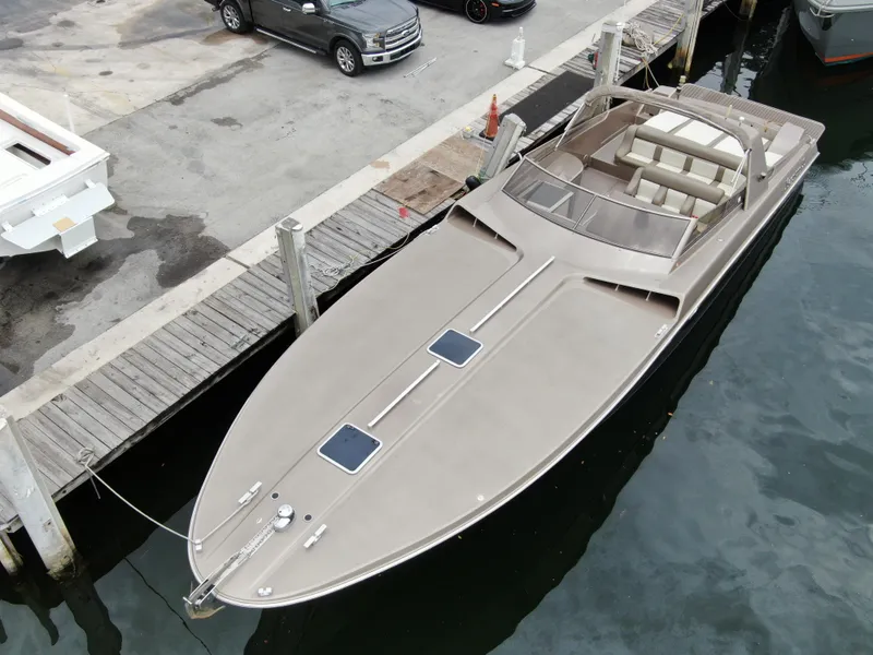 Slide: The Image of Aerial view of a 1998 Magnum 50 Bestia luxury boat docked at a marina. - 3