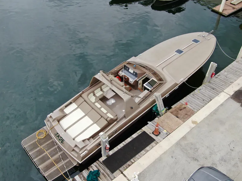 Slide: The Image of Aerial view of a 1998 Magnum 50 Bestia yacht docked at a marina. - 4