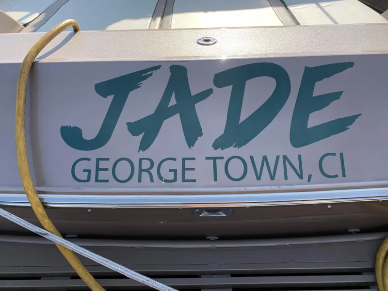 Slide: The Image of Magnum 50 Bestia 1998 boat named "Jade" docked in George Town, CI. - 7