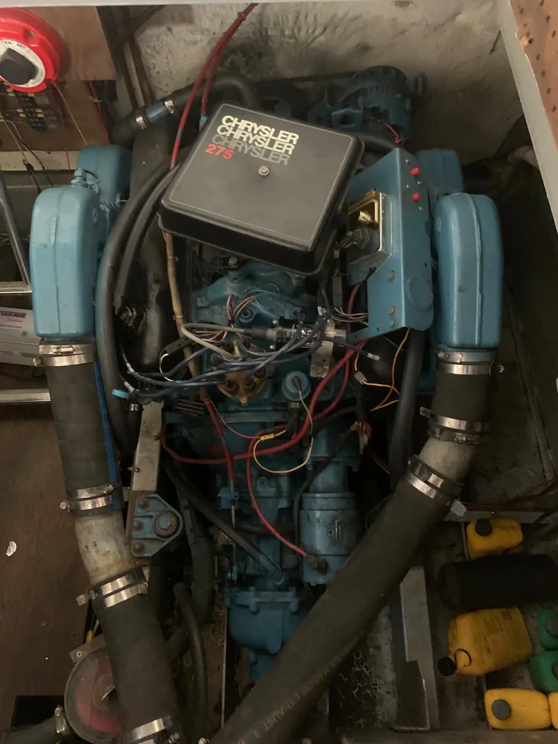 Slide: The Image of Alt text: 1987 Marinette Fisherman boat engine, Chrysler Crusader 270, in a boat's engine compartment. - 17