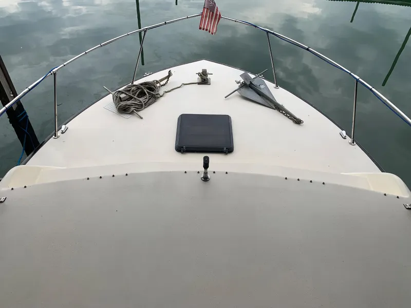Slide: The Image of 1987 Marinette Fisherman boat deck with anchor and rope. - 8