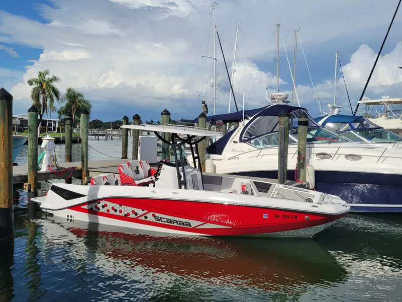 The Image of 2019 Scarab 255 Open ID boat docked at marina with other boats. - 27