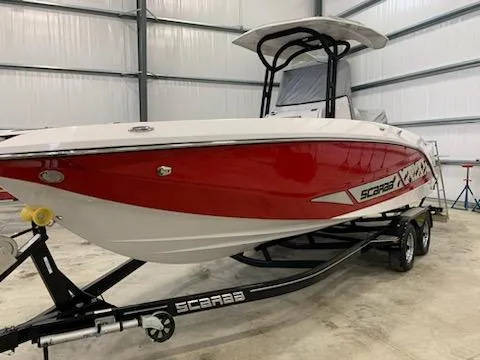 Slide: The Image of 2019 Scarab 255 Open ID boat in a storage facility. - 31