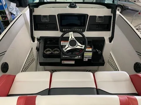 Slide: The Image of 2019 Scarab 255 Open ID boat dashboard with modern controls and red-white seating. - 36