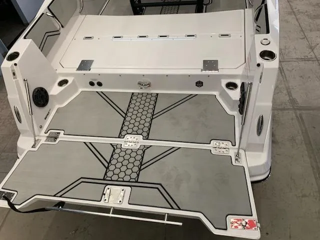 Slide: The Image of 2019 Scarab 255 Open ID boat deck with modern design and storage compartments. - 37