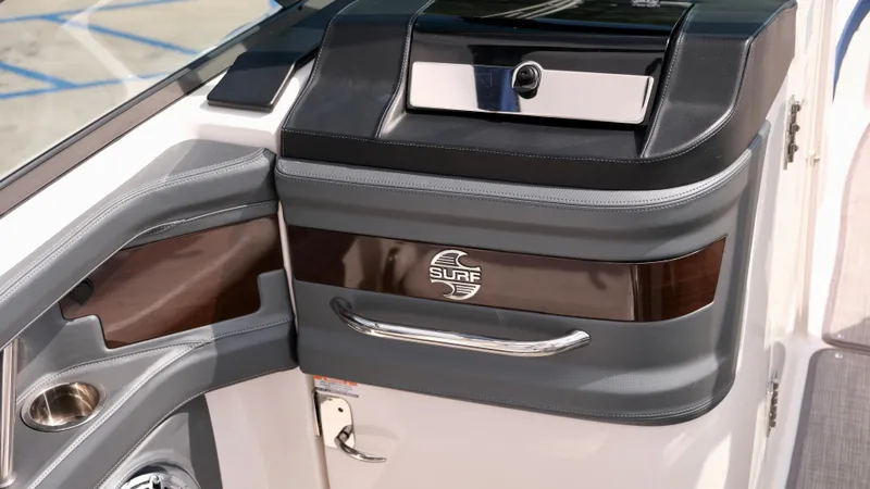 Slide: The Image of 2021 Chaparral 30 Surf boat interior detail with storage compartment and sleek design. - 10
