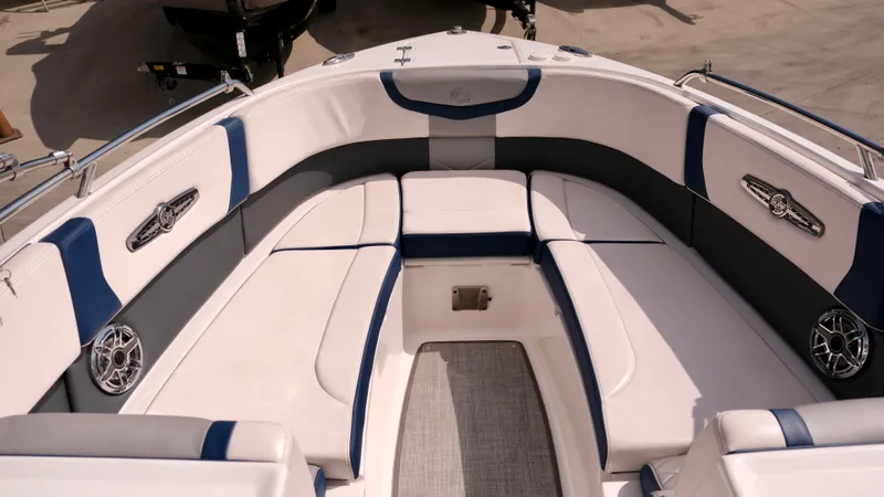 Slide: The Image of 2021 Chaparral 30 Surf boat interior with white and blue seating. - 12