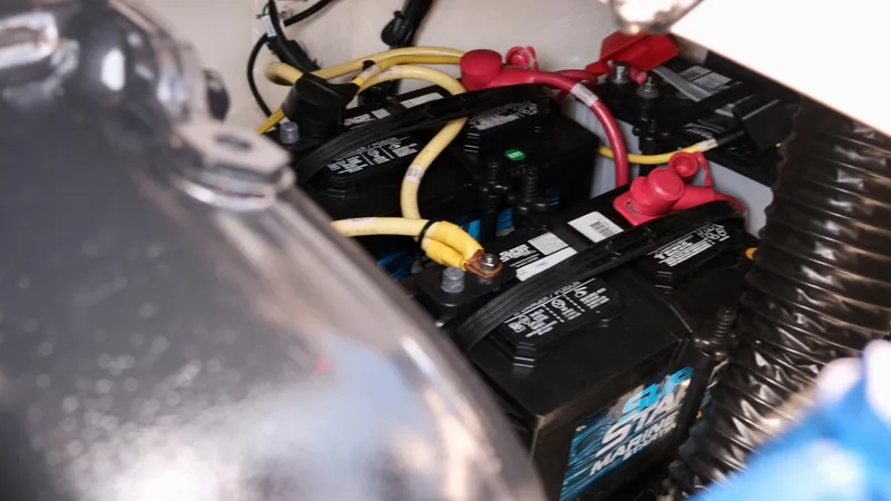 Slide: The Image of 2021 Chaparral 30 Surf boat battery compartment with wiring. - 19