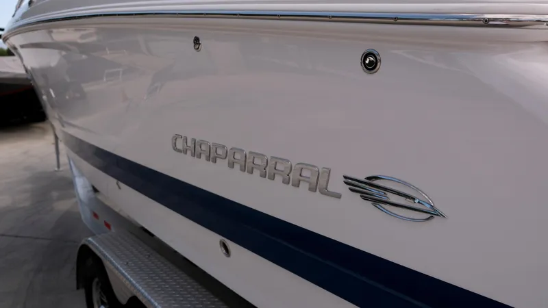 Slide: The Image of 2021 Chaparral 30 Surf boat side view with logo. - 21