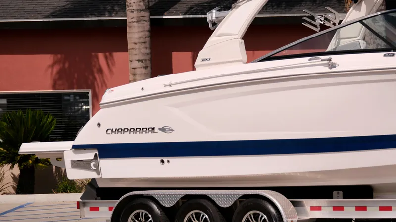 Slide: The Image of 2021 Chaparral 30 Surf boat on a trailer, side view. - 3