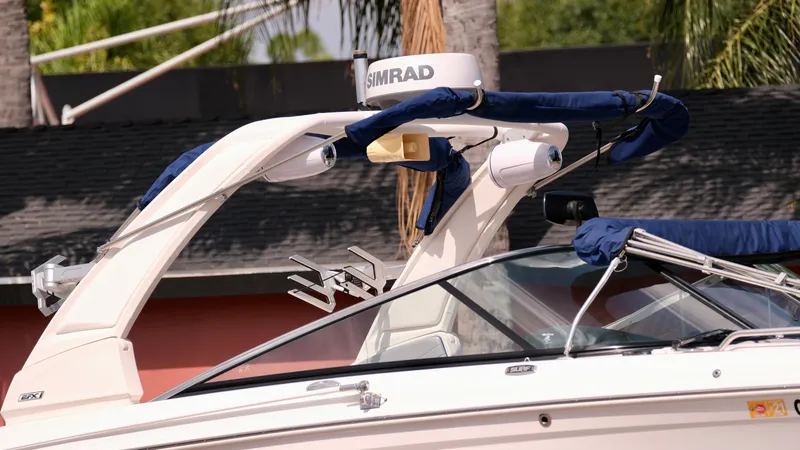 Slide: The Image of 2021 Chaparral 30 Surf boat with Simrad radar and blue canopy. - 4