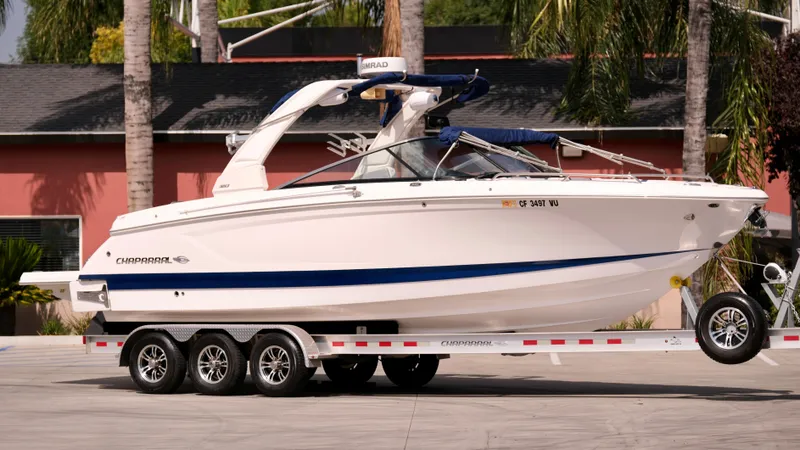 Slide: The Image of 2021 Chaparral 30 Surf boat on a trailer, side view. - 5