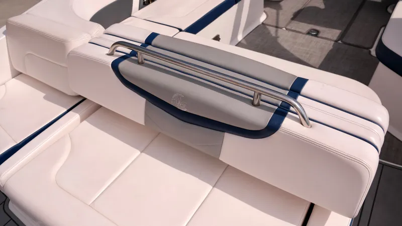 Slide: The Image of 2021 Chaparral 30 Surf boat interior seating with white and blue upholstery. - 8