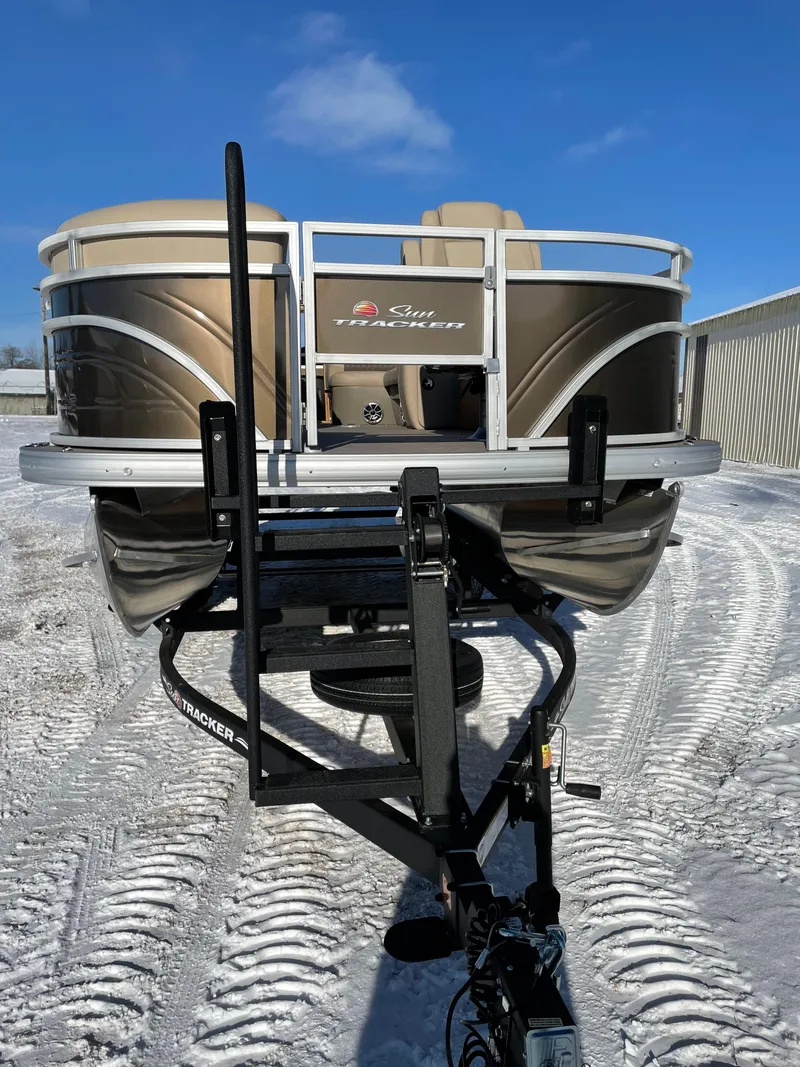 Slide: The Image of 2024 Sun Tracker SportFish 20 DLX pontoon boat on snowy ground. - 2