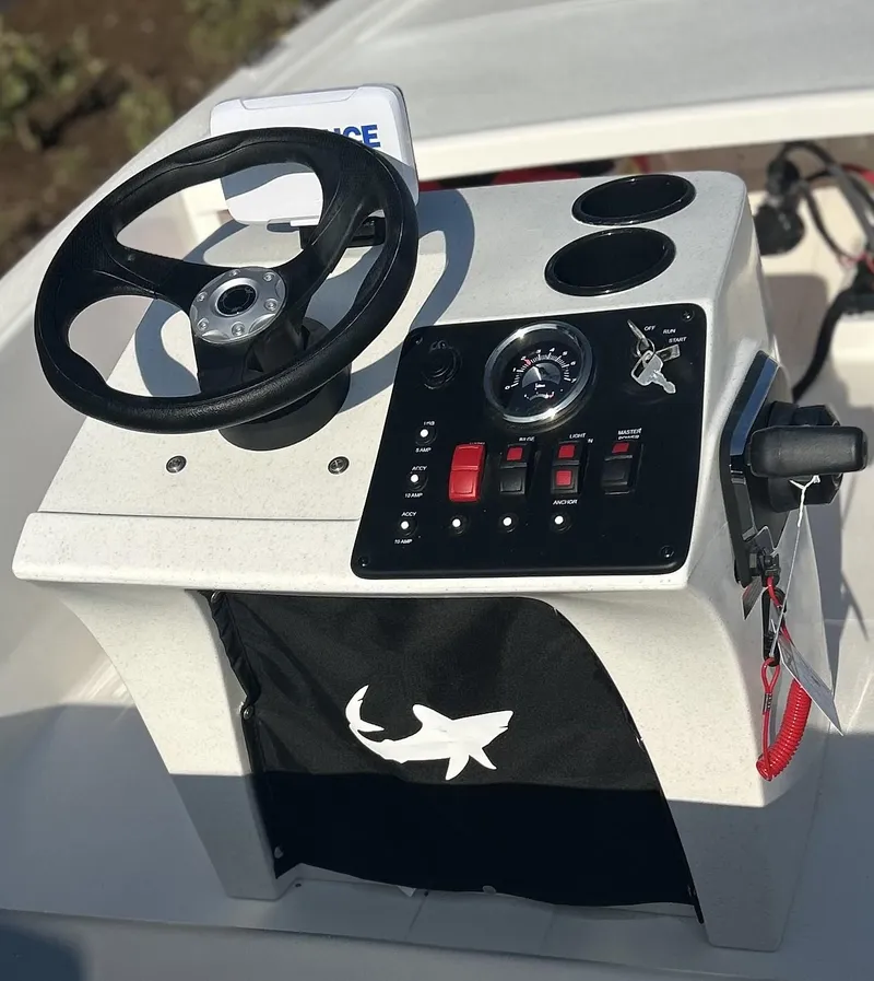 Slide: The Image of Control console of a 2024 Mako Pro Skiff 13 CC boat. - 3