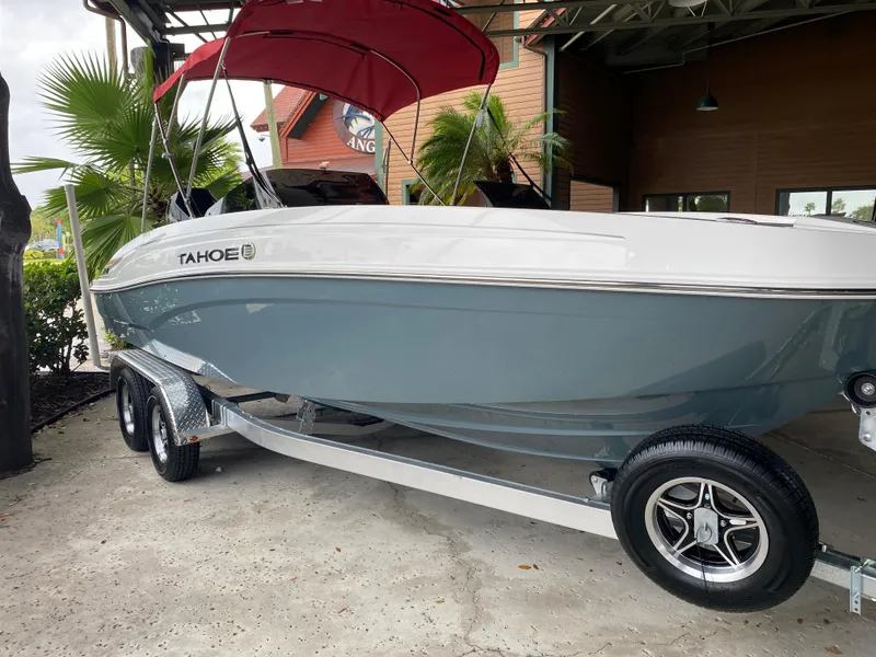 The Image of 2024 Tahoe T21 boat with red canopy on trailer. - 0