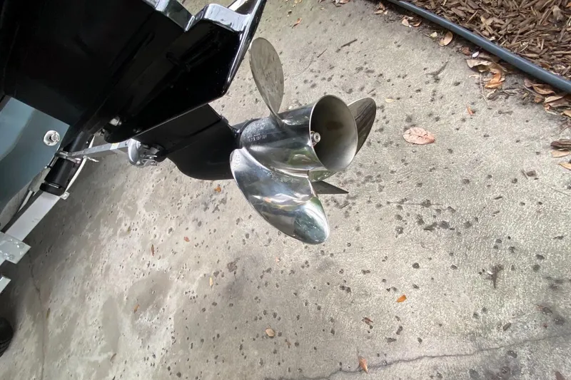 Slide: The Image of Close-up of 2024 Tahoe T21 boat propeller on concrete surface. - 9