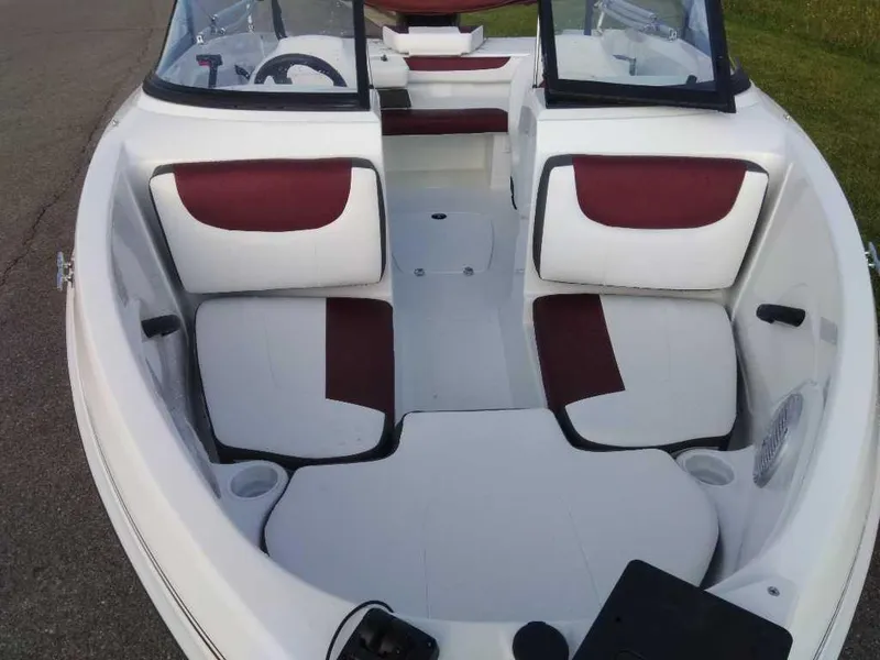 Slide: The Image of 2024 Tahoe 185 S boat interior with white and red seating. - 8