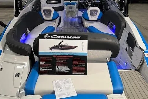 Slide: The Image of 2024 Crownline 280 SS boat interior with blue and white seating. - 1