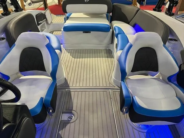 Slide: The Image of 2024 Crownline 280 SS boat interior with blue and white seating. - 5