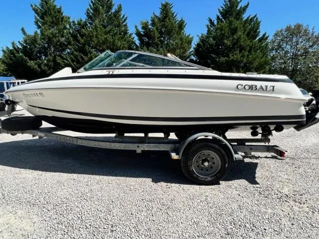 Slide: The Image of 2001 Cobalt 190 boat on a trailer, side view, outdoors. - 1