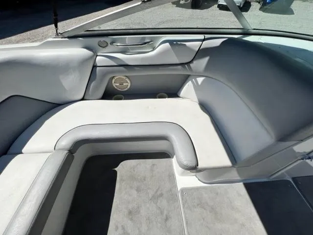 Slide: The Image of Interior of a 2001 Cobalt 190 boat with gray and white seating. - 11