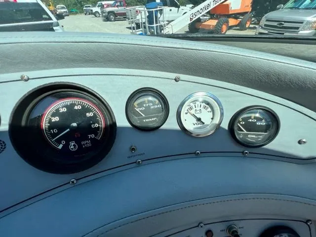 Slide: The Image of Dashboard gauges of a 2001 Cobalt 190 boat, showing RPM, temperature, voltage, and oil pressure. - 16