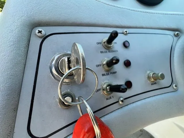 Slide: The Image of Close-up of 2001 Cobalt 190 boat ignition and control panel with key. - 18
