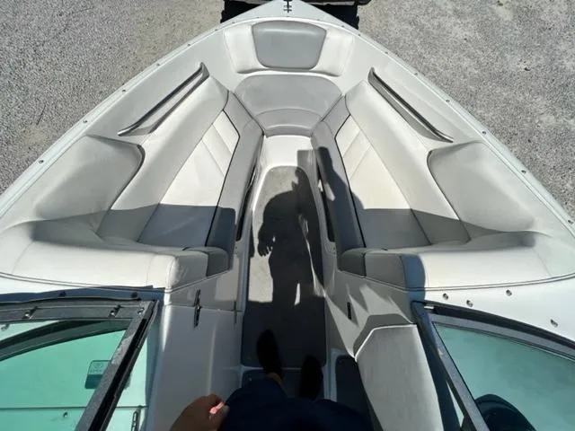 Slide: The Image of 2001 Cobalt 190 boat interior with white seating and open bow design. - 21