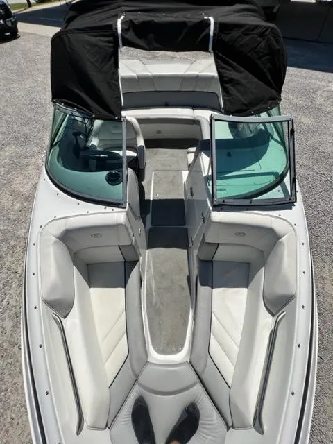 Slide: The Image of 2001 Cobalt 190 boat with open bow seating and black canopy. - 22